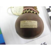 Rectangular paper label adhered to object