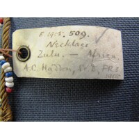 Rectangular parchment label tied to object