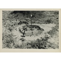 Negative of photograph of hearth at the uMgungundlovu excavation (back view)